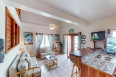 Breezy tropical Oceanfront 2-story condo with a shared pool & beach access!