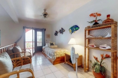 Breezy tropical Oceanfront 2-story condo with a shared pool & beach access!