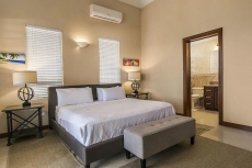 Third-floor condo w/ beach and ocean views, private front porch entrance, & deck