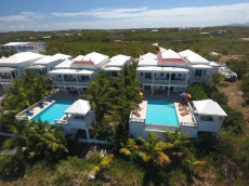 Third-floor condo w/ beach and ocean views, private front porch entrance, & deck