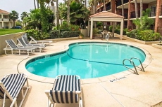 Island-style getaway with a shared pool/hot tub and beachside setting