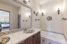 Colorful coastal retreat with sweeping ocean views, huge patio, & shared pool