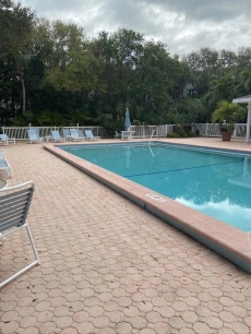 2 minute walk, beachside pool, bar and outside dining,16tennis courts. Gated.